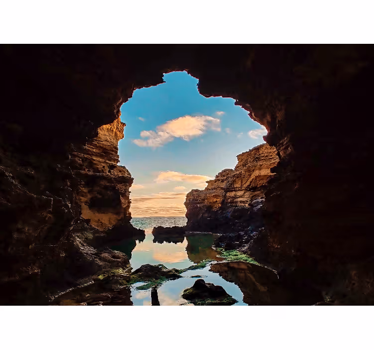 Tapisserie paysage vue sur mer en grotte - TenStickers