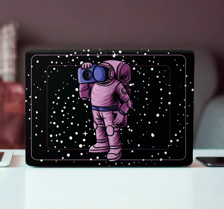 Sticker ordinateur astronaute tenant une caméra - TenStickers